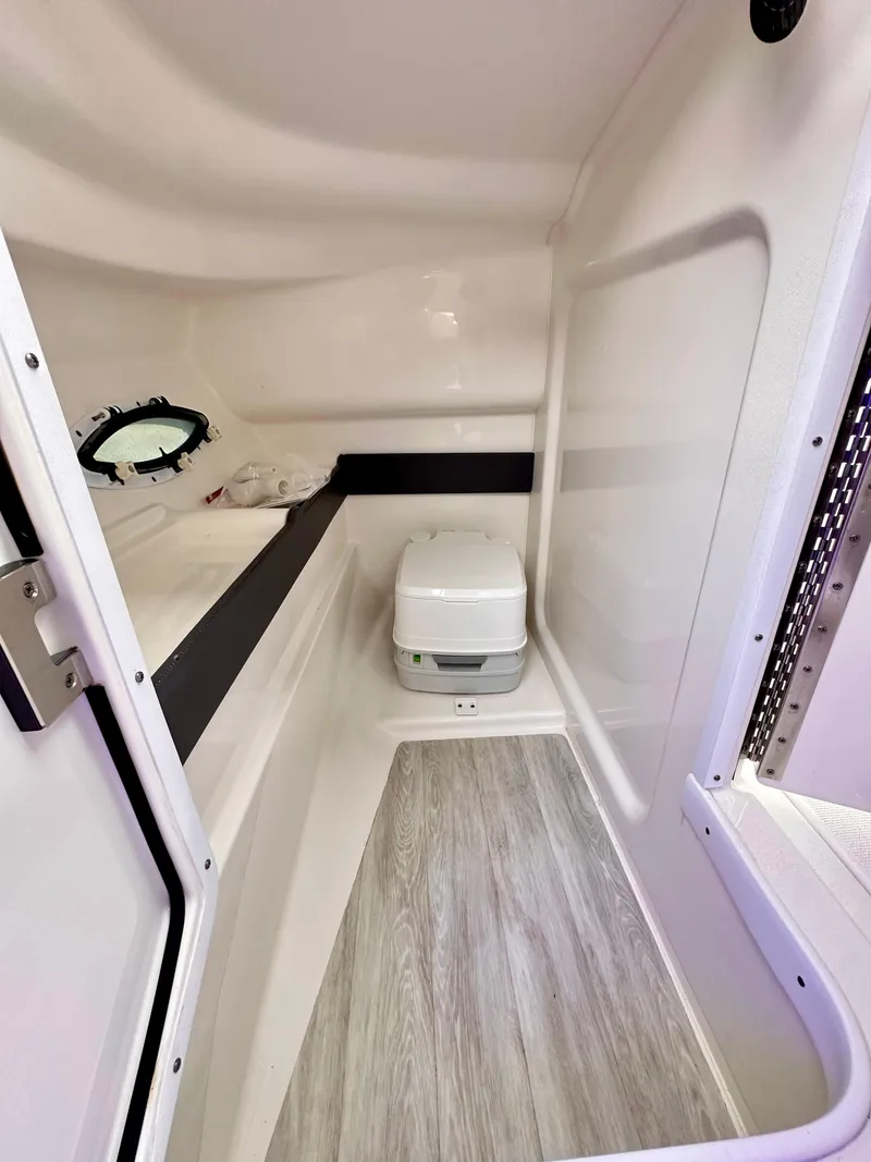 Slide: The Image of 2021 Formula 270 Bowrider interior cabin with compact toilet and modern design. - 22