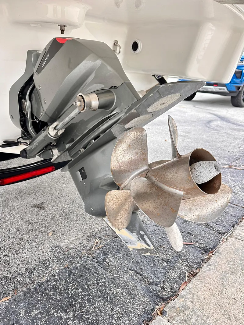 Slide: The Image of 2021 Formula 270 Bowrider boat propeller and outdrive detail on pavement. - 7