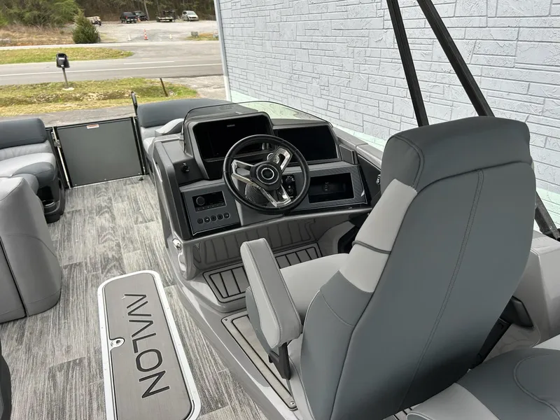 Slide: The Image of 2025 Avalon 2585 Catalina Quad Lounger interior with modern helm and seating. - 9