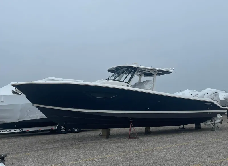 Slide: The Image of 2022 Pursuit S 378 Sport boat on display in a marina setting. - 20