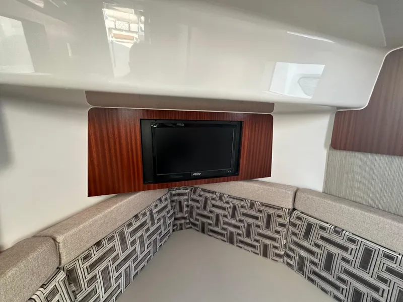 Slide: The Image of Interior of 2022 Pursuit S 378 Sport boat with TV and patterned seating. - 32