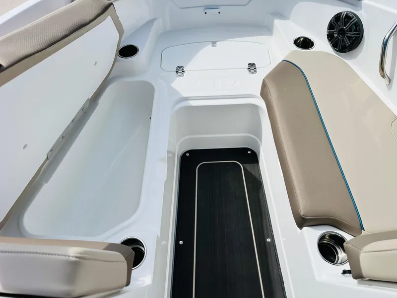 Slide: The Image of 2024 Tahoe 210 S Limited boat interior with seating and storage compartments. - 14