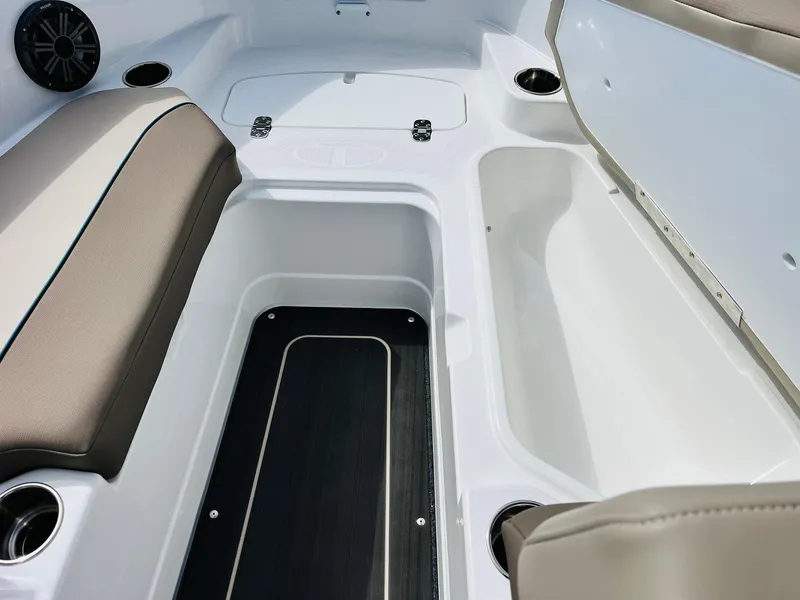 Slide: The Image of 2024 Tahoe 210 S Limited boat interior with seating and storage compartments. - 15