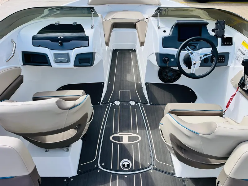 Slide: The Image of 2024 Tahoe 210 S Limited boat interior with modern dashboard and seating. - 18