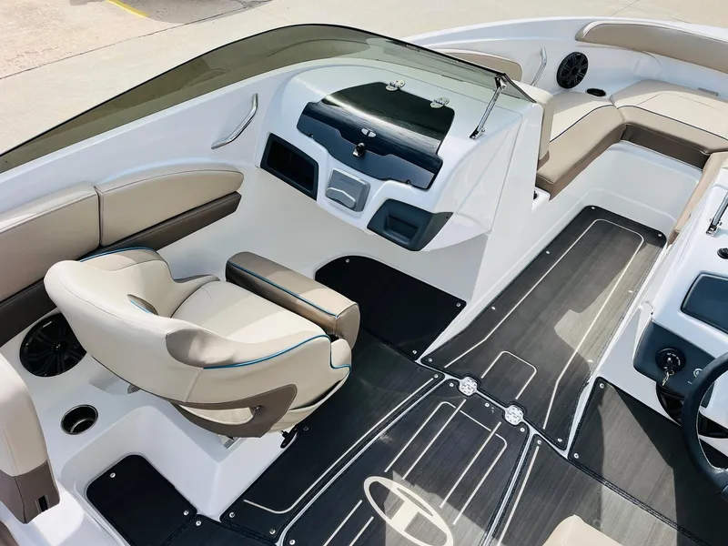 Slide: The Image of 2024 Tahoe 210 S Limited boat interior with modern seating and sleek dashboard design. - 21