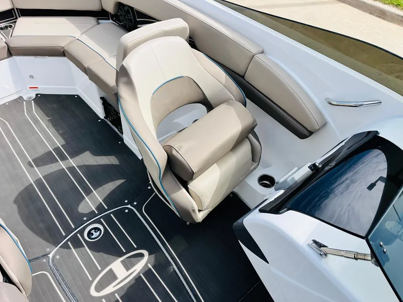 Slide: The Image of 2024 Tahoe 210 S Limited boat interior with plush seating and sleek design. - 23