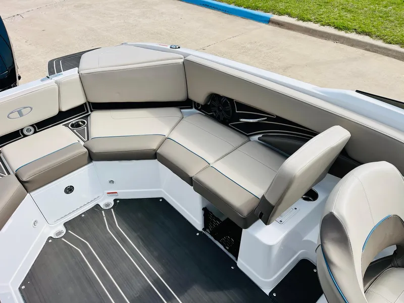 Slide: The Image of 2024 Tahoe 210 S Limited boat interior with gray seating and modern design. - 26