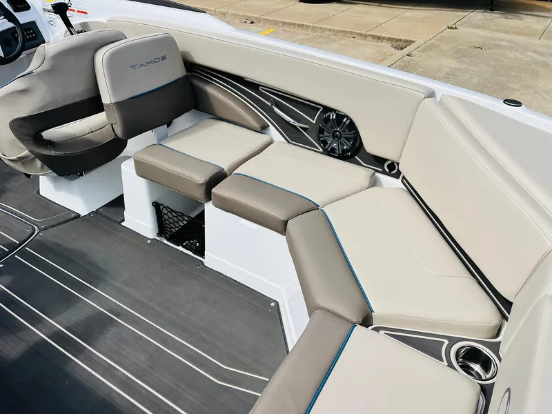Slide: The Image of 2024 Tahoe 210 S Limited boat interior with beige seating and modern design. - 28