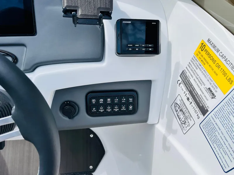 Slide: The Image of 2024 Tahoe 210 S Limited dashboard with controls and capacity label. - 43