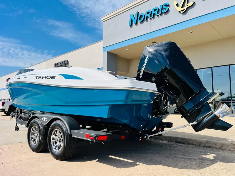 Slide: The Image of 2024 Tahoe 210 S Limited boat on trailer outside dealership. - 8