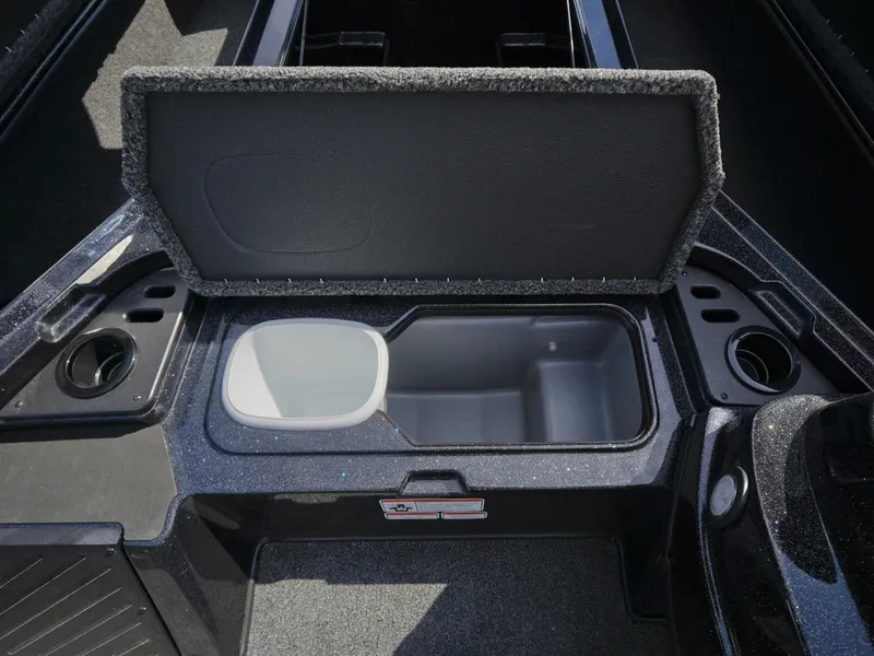 Slide: The Image of Open storage compartment in 2025 Nitro Z18 boat, featuring cup holders and sleek design. - 14