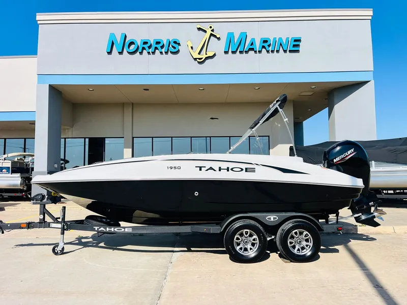 Slide: The Image of 2024 Tahoe 1950 boat at Norris Marine dealership, featuring sleek design and modern features. - 1