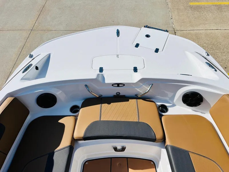 Slide: The Image of 2024 Tahoe 1950 boat interior with tan and black seating, modern design. - 12