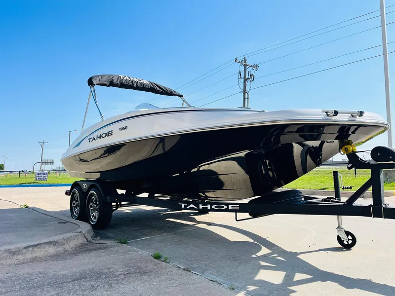 Slide: The Image of 2024 Tahoe 1950 boat on trailer, sleek design, sunny day, outdoor setting. - 3