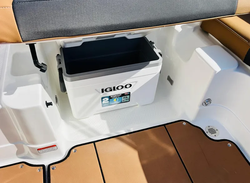 Slide: The Image of 2024 Tahoe 1950 boat interior with Igloo cooler storage compartment. - 33