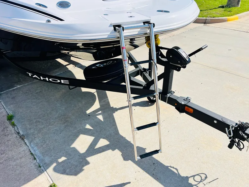 Slide: The Image of 2024 Tahoe 1950 boat trailer with ladder on a sunny day. - 4