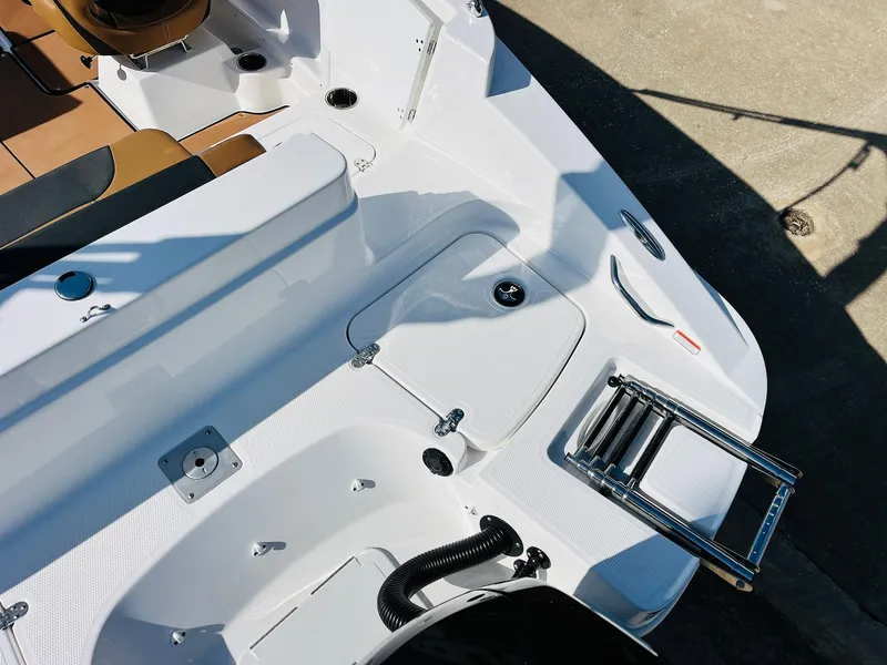 Slide: The Image of 2024 Tahoe 1950 boat deck with seating and retractable ladder. - 46