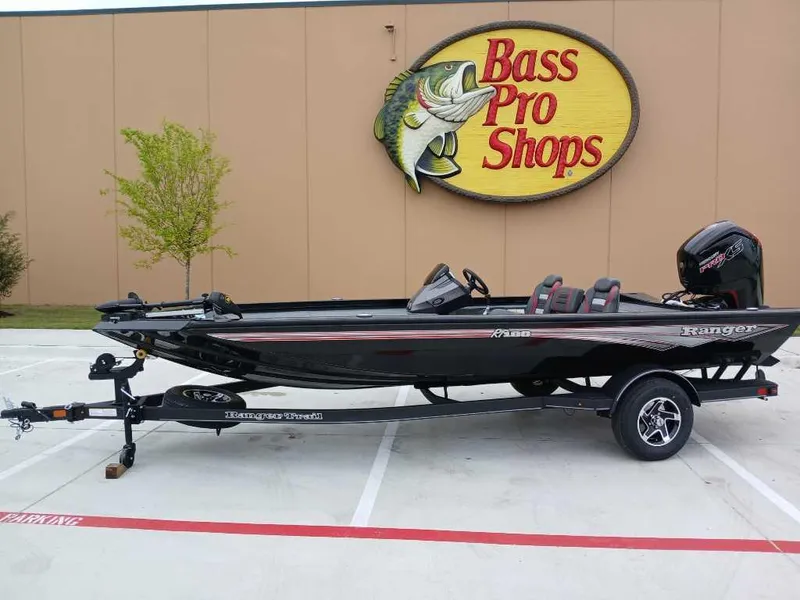 Slide: The Image of 2025 Ranger RT188 boat parked outside Bass Pro Shops. - 0