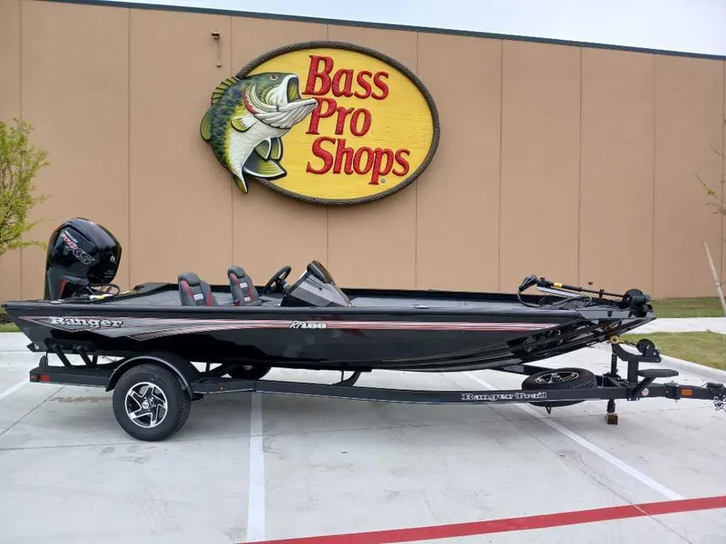 Slide: The Image of 2025 Ranger RT188 boat on trailer outside Bass Pro Shops. - 1