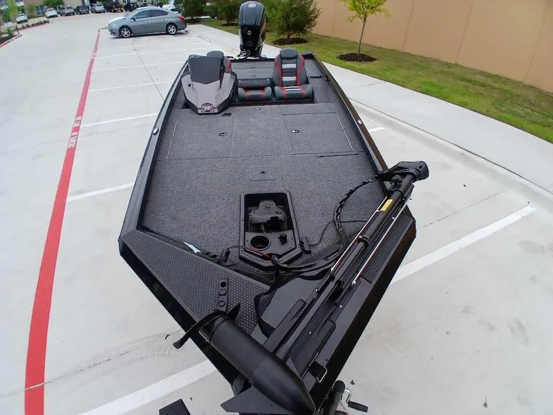 Slide: The Image of 2025 Ranger RT188 fishing boat in parking lot, featuring spacious deck and modern design. - 6