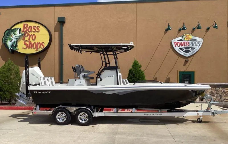Slide: The Image of 2025 Ranger 2360 Bay boat on trailer outside Bass Pro Shops. - 5