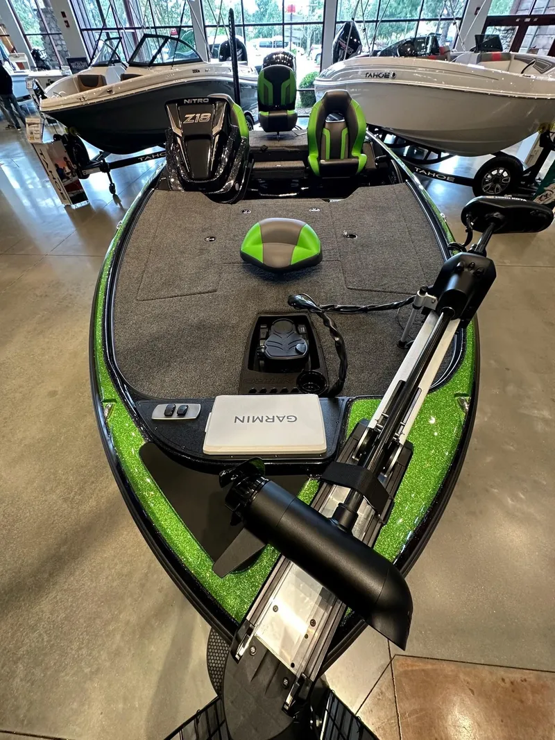 Slide: The Image of 2025 Nitro Z18 Pro fishing boat with Garmin equipment, displayed indoors. - 3