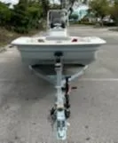 Slide: The Image of 2025 Mako Pro Skiff 15 CC boat on trailer in parking lot. - 10