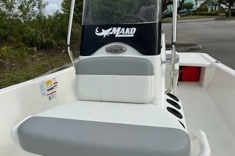 Slide: The Image of 2025 Mako Pro Skiff 15 CC boat interior with seating and console. - 3