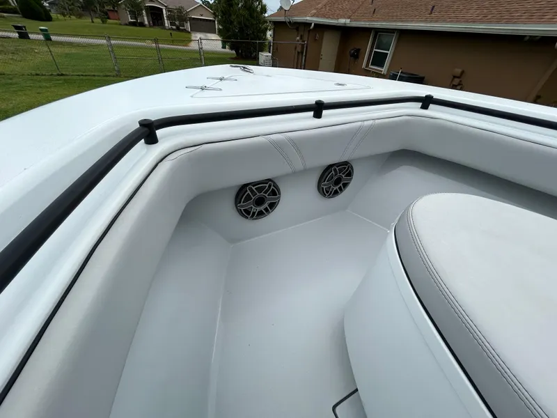 Slide: The Image of 2024 Contender 28 Tournament boat interior with speakers and cushioned seating. - 14