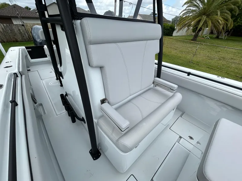 Slide: The Image of 2024 Contender 28 Tournament boat with sleek white seating and modern design. - 16