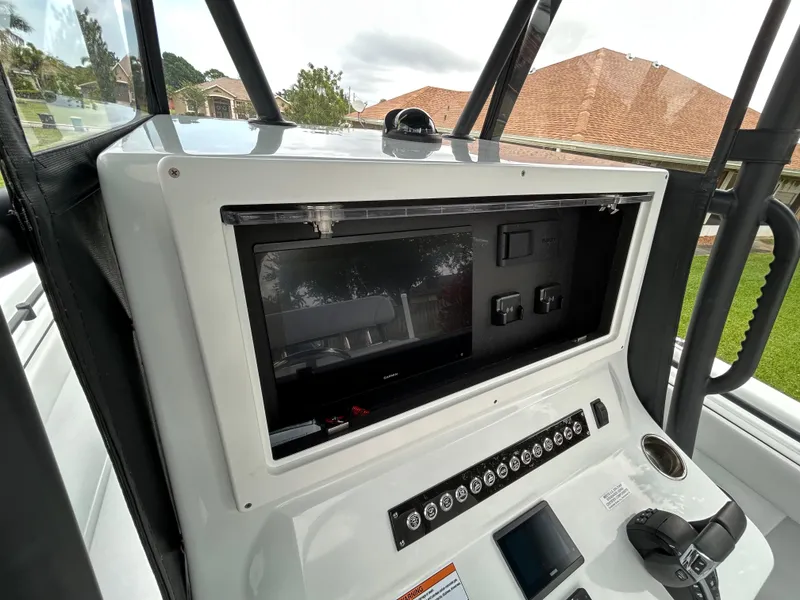 Slide: The Image of 2024 Contender 28 Tournament boat dashboard with modern controls and navigation system. - 26