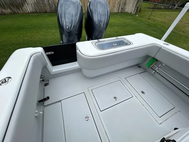 Slide: The Image of 2024 Contender 28 Tournament boat deck with dual engines and storage compartments. - 30