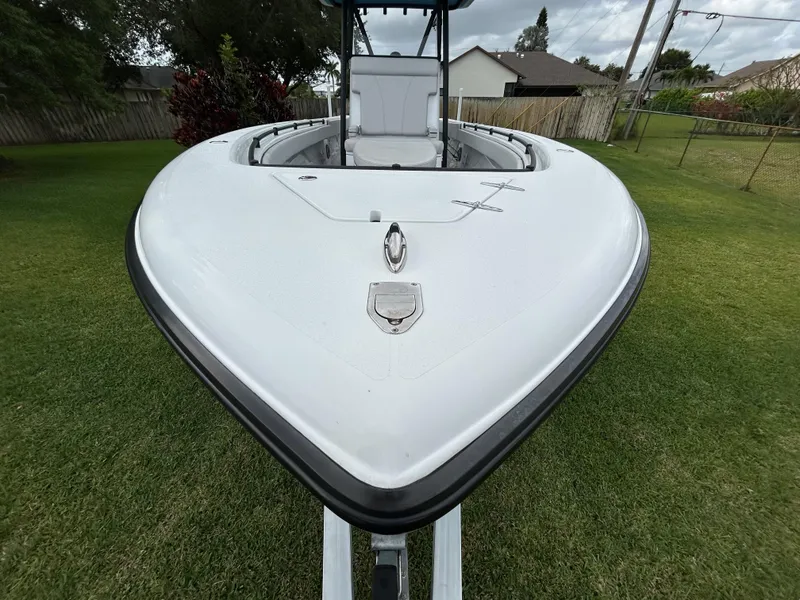 Slide: The Image of 2024 Contender 28 Tournament boat on grass, front view. - 5