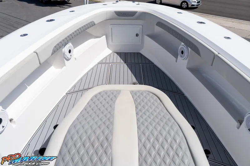 Slide: The Image of 2023 Front Runner 39 Center Console boat interior with diamond-stitched seating and sleek design. - 10