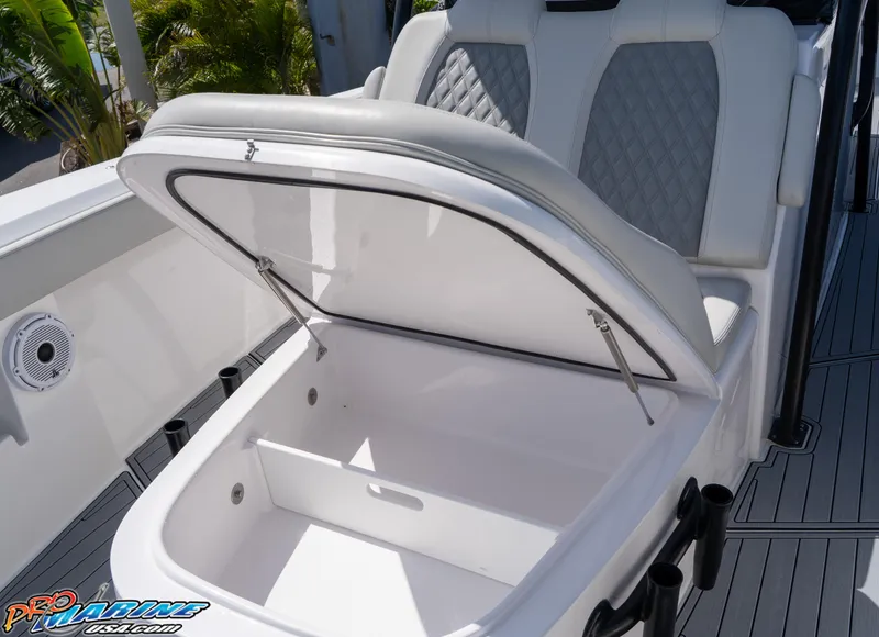 Slide: The Image of 2023 Front Runner 39 Center Console boat with open storage compartment and cushioned seating. - 12