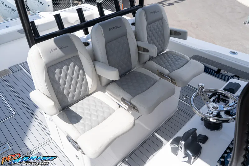 Slide: The Image of Luxury seating on 2023 Front Runner 39 Center Console boat, featuring plush, diamond-stitched upholstery. - 16