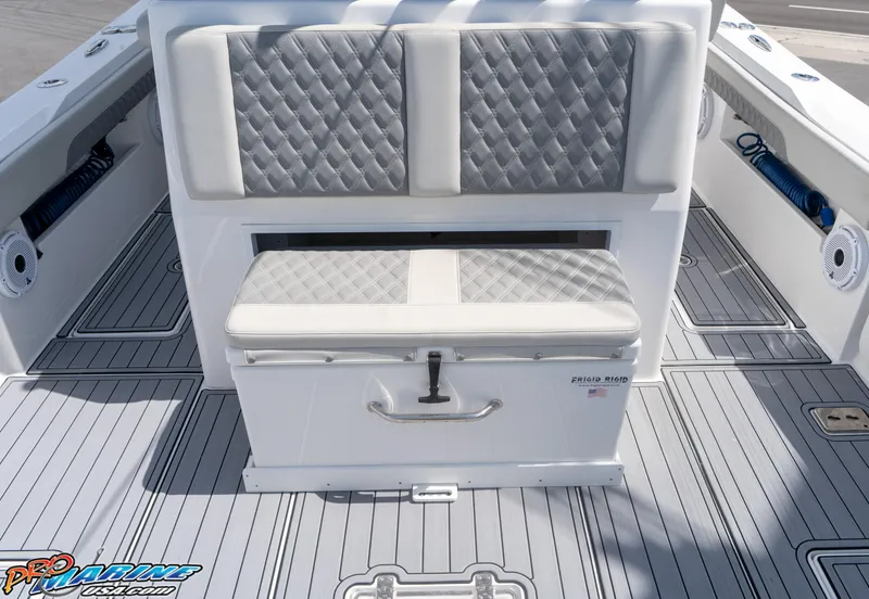 Slide: The Image of 2023 Front Runner 39 Center Console boat interior with cushioned seating and storage. - 22