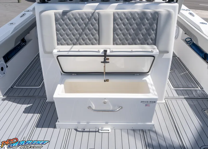 Slide: The Image of 2023 Front Runner 39 Center Console boat with open storage compartment and cushioned seating. - 23