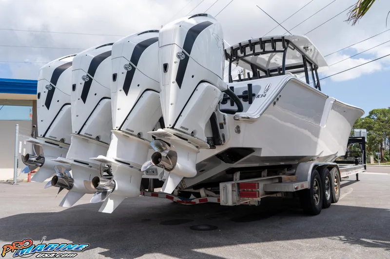 Slide: The Image of 2023 Front Runner 39 Center Console boat with four powerful outboard engines on a trailer. - 4
