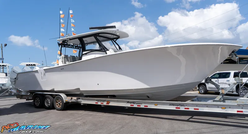 Slide: The Image of 2023 Front Runner 39 Center Console boat on trailer under blue sky. - 5
