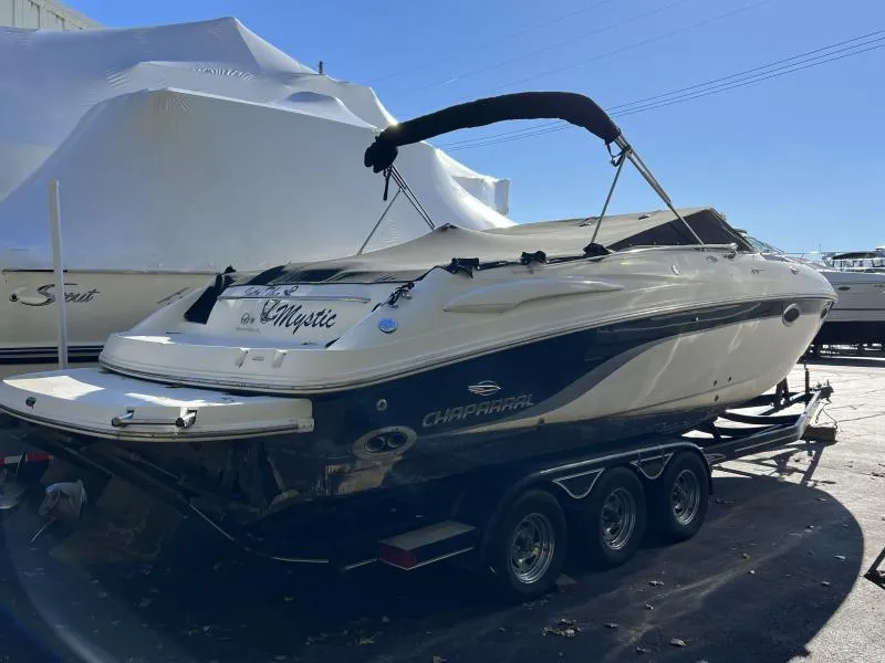 Slide: The Image of 2001 Chaparral 285 SSi boat on trailer, covered in marina, side view. - 3