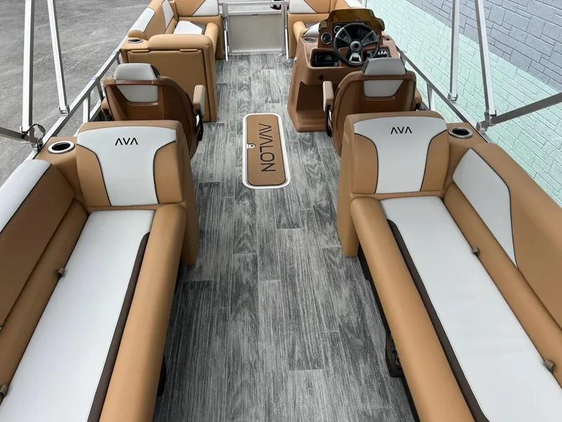 Slide: The Image of 2025 Avalon 2380 Venture Quad Lounger interior with tan and white seating, wood-style flooring. - 10