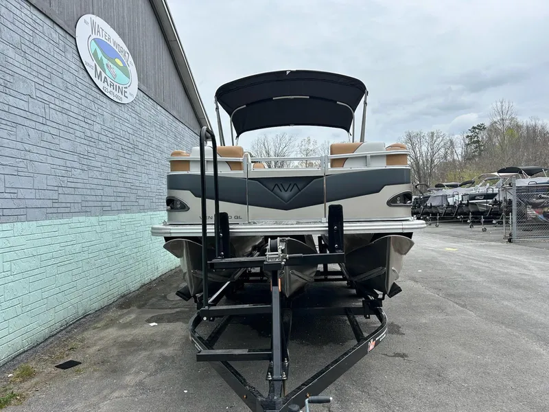 Slide: The Image of 2025 Avalon 2380 Venture Quad Lounger pontoon boat on trailer at marina. - 3
