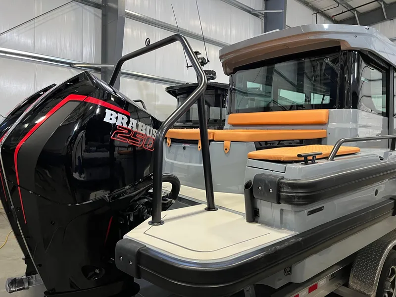 Slide: The Image of 2022 BRABUS Shadow 500 Cabin boat with powerful engine and sleek design in a showroom. - 10