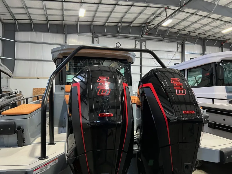 Slide: The Image of 2022 BRABUS Shadow 500 Cabin with dual 250 engines in a warehouse setting. - 11