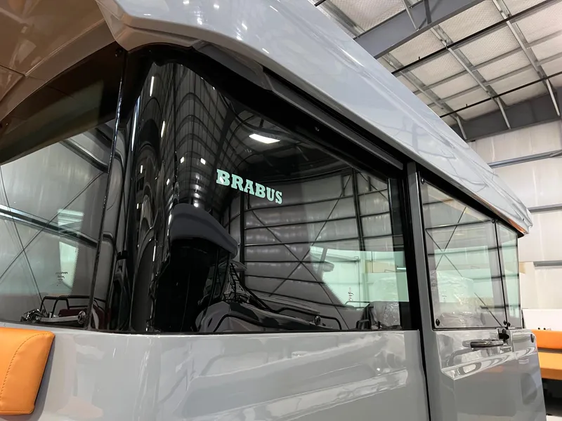 Slide: The Image of 2022 BRABUS Shadow 500 Cabin boat in a modern indoor setting. - 12