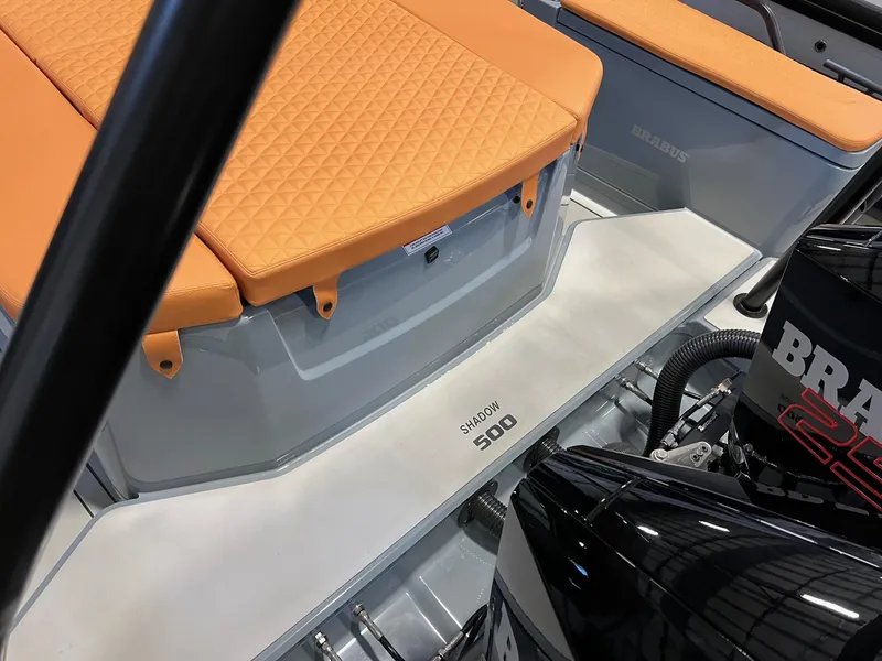 Slide: The Image of 2022 BRABUS Shadow 500 Cabin with orange seating and powerful engine. - 17