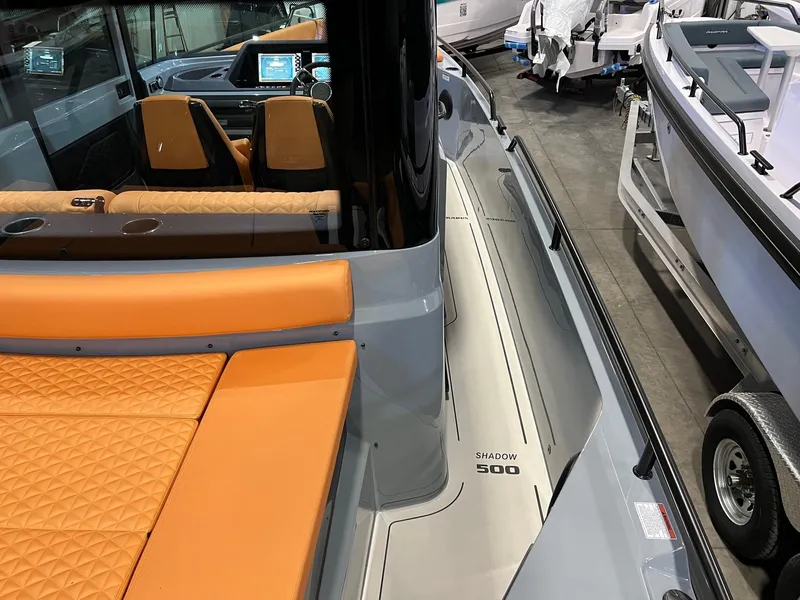 Slide: The Image of 2022 BRABUS Shadow 500 Cabin with orange seating and modern dashboard. - 19
