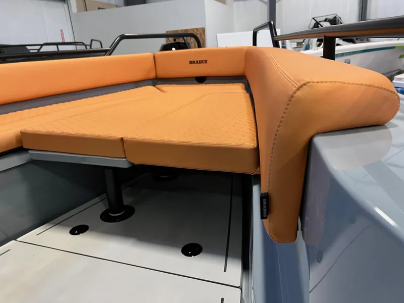 Slide: The Image of 2022 BRABUS Shadow 500 Cabin with orange seating in a sleek interior design. - 23