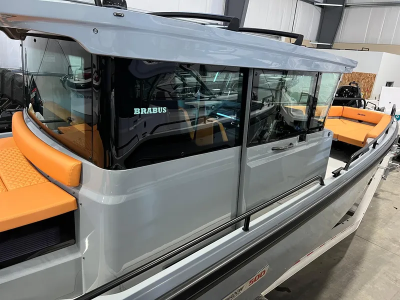 Slide: The Image of 2022 BRABUS Shadow 500 Cabin boat with sleek design and orange seating. - 3